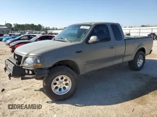 1999 Ford F-150 with VIN 1FTRX17W1XNC25527, listed as a Copart auction lot 48662525 with 150,544 mi miles and Salvage Title. Bid and sale history available at DreamBid. Image 1.