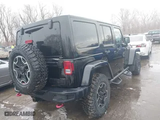 2015 Jeep Wrangler Unlimited Rubicon Hard Rock with VIN 1C4HJWFG9FL569962, listed as a IAAI auction lot 41557801 with 78,597 mi miles. Bid and sale history available at carsss.com. Image 4.