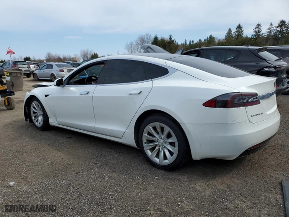 2017 Tesla Model S 100D with VIN 5YJSA1E24HF186757, listed as a Copart auction lot 51511745 with 242,779 mi miles and Salvage Title. Bid and sale history available at carsss.com. Image 2.