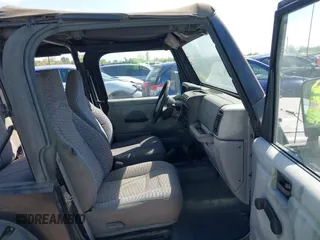1998 Jeep Wrangler SE with VIN 1J4FY29P1WP806244, listed as a IAAI auction lot 41885627 with 131,486 mi miles. Bid and sale history available at carsss.com. Image 5.