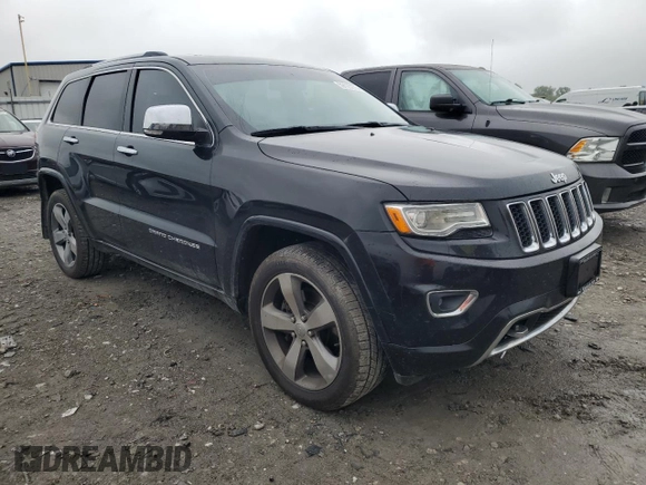 2015 Jeep Grand Cherokee Overland with VIN 1C4RJFCT2FC762573, listed as a Copart auction lot 59123275 with 229,128 mi miles and Salvage title. Bid and sale history available at DreamBid. Image 4.