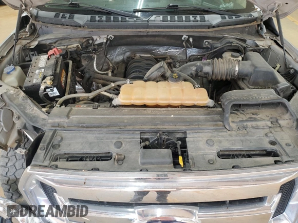 2015 Ford F-150 XLT с VIN 1FTEW1EF7FFA40475, выставлен на аукционе Copart как лот 55619615 с пробегом 200 254 миль миль и Списание • Salvage title. История ставок и продаж доступна на DreamBid. Изображение 11.
