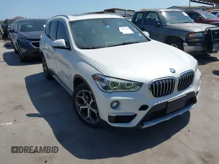 2016 BMW X1 xDrive28i z VIN WBXHT3C30GP888612, wystawiony jako IAAI lot #42017120 z przebiegiem 115 054 mil mil oraz . Historia ofert i sprzedaży dostępna na DreamBid. Obrazek 1.