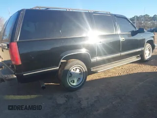 1999 GMC Suburban with VIN 3GKEC16R6XG549656, listed as a IAAI auction lot 41403259 with 306,548 mi miles. Bid and sale history available at carsss.com. Image 4.