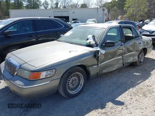 2001 Mercury Grand Marquis LS with VIN 2MEFM75W21X664449, listed as a IAAI auction lot 41898463 with 290,047 mi miles and . Bid and sale history available at DreamBid. Image 2.