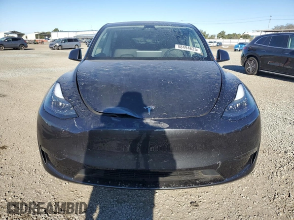 2024 Tesla Model Y with VIN 7SAYGDED4RF017614, listed as a Copart auction lot 88494625 with 11,209 mi miles and Salvage title. Bid and sale history available at DreamBid. Image 5.