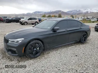 2018 BMW 7 Series 750i with VIN WBA7F0C55JGM23537, listed as a Copart auction lot 76824074 with 64,682 mi miles and Salvage Title. Bid and sale history available at carsss.com. Image 1.