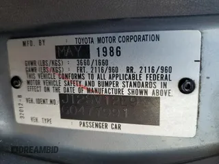 1986 Toyota Camry z VIN JT2SV12E9G0477991, wystawiony jako Copart lot #85531214 z przebiegiem 297 033 mil mil oraz Czysty tytuł • Clean title. Historia ofert i sprzedaży dostępna na DreamBid. Obrazek 12.