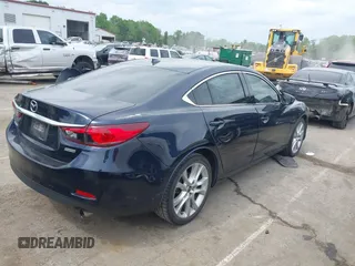 2016 Mazda Mazda6 i Touring with VIN JM1GJ1V59G1402867, listed as a IAAI auction lot 41998212 with 135,724 mi miles. Bid and sale history available at carsss.com. Image 4.