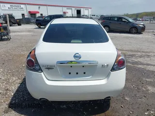2009 Nissan Altima 2.5 S with VIN 1N4AL21E89N561120, listed as a IAAI auction lot 42020054 with 220,237 mi miles. Bid and sale history available at carsss.com. Image 16.