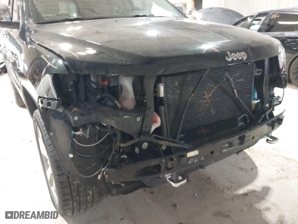 2014 Jeep Grand Cherokee Overland with VIN 1C4RJFCGXEC162109, listed as a IAAI auction lot 41943979 with 147,788 mi miles. Bid and sale history available at carsss.com. Image 18.