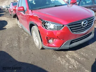2016 Mazda CX-5 Touring with VIN JM3KE4CY0G0901356, listed as a IAAI auction lot 41641742 with 96,950 mi miles. Bid and sale history available at carsss.com. Image 6.
