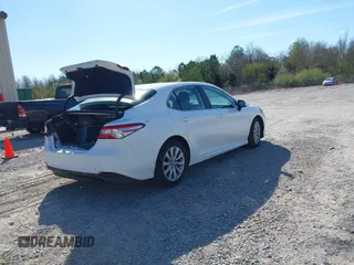 2020 Toyota Camry LE with VIN 4T1C11AK9LU315906, listed as a IAAI auction lot 41809360 with 97,401 mi miles. Bid and sale history available at carsss.com. Image 4.