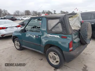 1997 Chevrolet Tracker z VIN 2CNBJ1864V6904934, wystawiony jako IAAI lot #41512446 z przebiegiem 223 032 mil mil oraz . Historia ofert i sprzedaży dostępna na DreamBid. Obrazek 3.