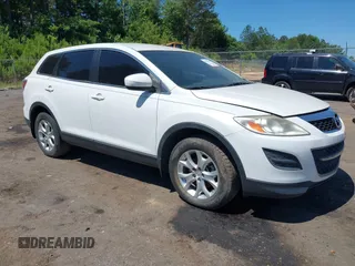 2012 Mazda CX-9 Sport z VIN JM3TB2BA6C0361981, wystawiony jako IAAI lot #42320797 z przebiegiem 152 239 mil mil oraz . Historia ofert i sprzedaży dostępna na DreamBid. Obrazek 1.