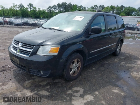 2010 Dodge Grand Caravan SXT with VIN 2D4RN5D11AR459864, listed as a IAAI auction lot 42197818 with 149,553 mi miles and . Bid and sale history available at DreamBid. Image 2.