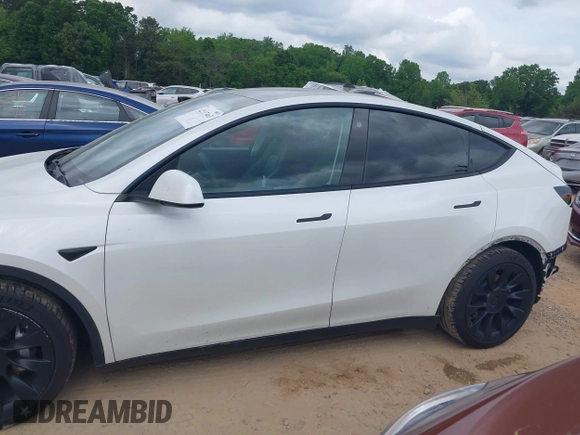 2021 Tesla Model Y Long Range with VIN 5YJYGDEE7MF198867, listed as a IAAI auction lot 42117463 with 79,759 mi miles and . Bid and sale history available at DreamBid. Image 14.
