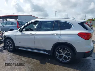 2018 BMW X1 sDrive28i z VIN WBXHU7C34J5H40814, wystawiony jako IAAI lot #42291108 z przebiegiem 93 200 mil mil oraz . Historia ofert i sprzedaży dostępna na DreamBid. Obrazek 14.