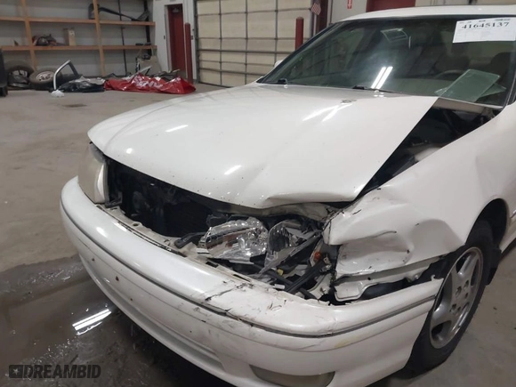 1999 Toyota Avalon XL with VIN 4T1BF18B2XU293904, listed as a IAAI auction lot 41645137 with NaN miles. Bid and sale history available at carsss.com. Image 6.