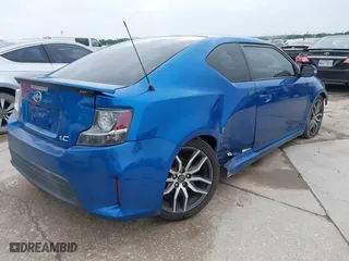 2014 Scion tC with VIN JTKJF5C77E3081277, listed as a IAAI auction lot 41932581 with 135,556 mi miles. Bid and sale history available at carsss.com. Image 4.