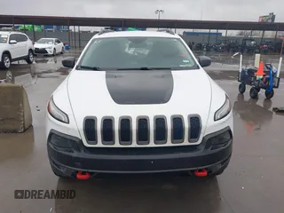 2015 Jeep Cherokee Trailhawk with VIN 1C4PJMBB1FW630519, listed as a IAAI auction lot 41605466 with 219,390 mi miles and . Bid and sale history available at carsss.com. Image 13.