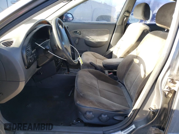 2003 Kia Spectra with VIN KNAFB121935265035, listed as a Copart auction lot 86407934 with 201,586 mi miles and Salvage Title. Bid and sale history available at DreamBid. Image 7.