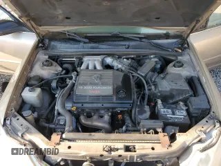 2000 Toyota Avalon XL z VIN 4T1BF28B2YU079163, wystawiony jako Copart lot #50129935 z przebiegiem 311 916 mil mil oraz Nie do naprawy • Non repairable. Historia ofert i sprzedaży dostępna na DreamBid. Obrazek 11.
