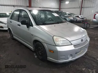 2003 Suzuki Aerio S z VIN JS2RA41S335159927, wystawiony jako IAAI lot #42012847 z przebiegiem 132 482 mil mil oraz . Historia ofert i sprzedaży dostępna na DreamBid. Obrazek 1.