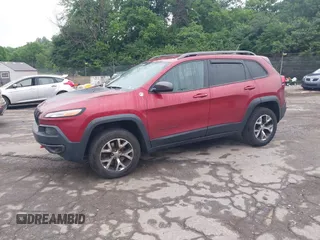 2015 Jeep Cherokee Trailhawk with VIN 1C4PJMBSXFW667469, listed as a IAAI auction lot 42438006 with 127,136 mi miles and . Bid and sale history available at DreamBid. Image 18.