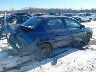 2003 Mitsubishi Lancer ES with VIN JA3AJ26E13U0A3996, listed as a IAAI auction lot 41251250 with 223,311 mi miles. Bid and sale history available at carsss.com. Image 4.