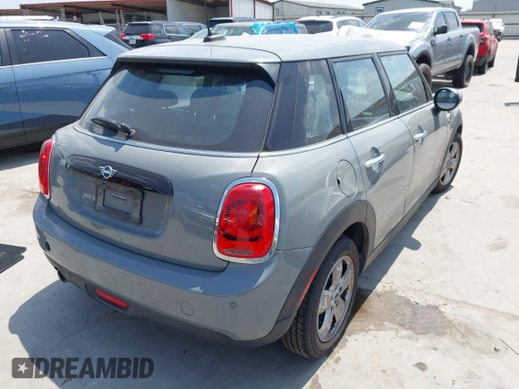 2021 MINI Hardtop 4 Door Oxford Edition with VIN WMWXU7C09M2P17351, listed as a IAAI auction lot 42330197 with 51,628 mi miles and . Bid and sale history available at DreamBid. Image 4.
