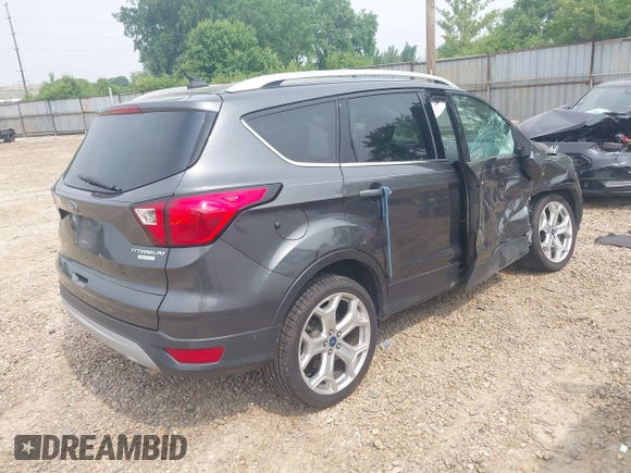 2019 Ford Escape Titanium with VIN 1FMCU0J97KUA34281, listed as a IAAI auction lot 42409579 with 55,400 mi miles and . Bid and sale history available at DreamBid. Image 4.