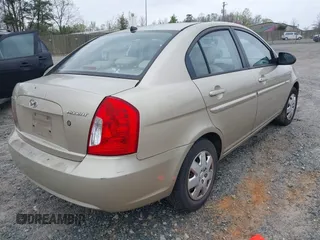 2006 Hyundai Accent GLS z VIN KMHCN46C66U058232, wystawiony jako IAAI lot #41899629 z przebiegiem 182 669 mil mil oraz . Historia ofert i sprzedaży dostępna na DreamBid. Obrazek 4.