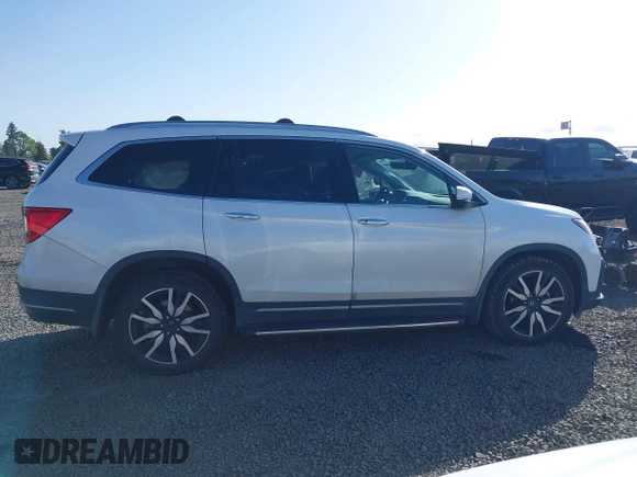 2021 Honda Pilot Touring 8-Passenger with VIN 5FNYF6H92MB031782, listed as a IAAI auction lot 42087322 with 70,062 mi miles and . Bid and sale history available at DreamBid. Image 13.