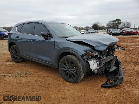 2023 Mazda CX-5 S Carbon Edition with VIN JM3KFBCM9P0280049, listed as a Copart auction lot 85712024 with 13,694 mi miles and Salvage Title. Bid and sale history available at DreamBid. Image 4.