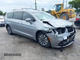 2021 Chrysler Pacifica Hybrid Touring L z VIN 2C4RC1L79MR594547, wystawiony jako IAAI lot #42221490 z przebiegiem 91 890 mil mil oraz . Historia ofert i sprzedaży dostępna na DreamBid. Obrazek 1.