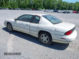 1998 Chevrolet Monte Carlo LS z VIN 2G1WW12MXW9114335, wystawiony jako IAAI lot #42284798 z przebiegiem 214 728 mil mil oraz . Historia ofert i sprzedaży dostępna na DreamBid. Obrazek 3.