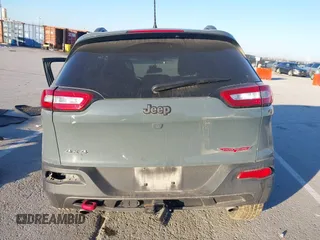 2015 Jeep Cherokee Trailhawk with VIN 1C4PJMBSXFW614416, listed as a IAAI auction lot 41033241 with 112,015 mi miles. Bid and sale history available at carsss.com. Image 17.