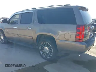 2011 Chevrolet Suburban LT with VIN 1GNSCJE03BR381301, listed as a IAAI auction lot 41412636 with 243,601 mi miles. Bid and sale history available at carsss.com. Image 3.
