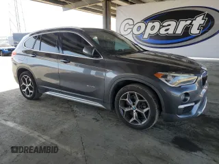 2016 BMW X1 xDrive28i with VIN WBXHT3Z38G4A49061, listed as a Copart auction lot 54010455 with 120,875 mi miles and Salvage Title. Bid and sale history available at DreamBid. Image 4.