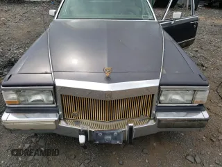 1991 Cadillac Brougham z VIN 1G6DW54EXMR701457, wystawiony jako Copart lot #70194104 z przebiegiem Nie podano mil oraz Nie do naprawy. Historia ofert i sprzedaży dostępna na DreamBid. Obrazek 11.