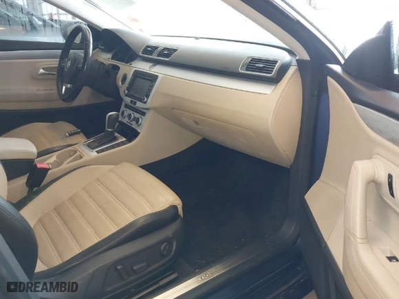 2013 Volkswagen CC Sport with VIN WVWBN7ANXDE515691, listed as a IAAI auction lot 41598295 with 104,461 mi miles. Bid and sale history available at carsss.com. Image 5.