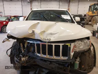 2011 Jeep Grand Cherokee 70th Anniversary with VIN 1J4RR4GG4BC702759, listed as a IAAI auction lot 41871604 with 143,583 mi miles. Bid and sale history available at carsss.com. Image 12.
