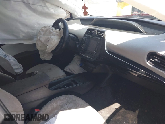 2020 Toyota Prius L Eco z VIN JTDKARFU0L3109596, wystawiony jako IAAI lot #41950366 z przebiegiem Nie podano mil oraz . Historia ofert i sprzedaży dostępna na DreamBid. Obrazek 5.
