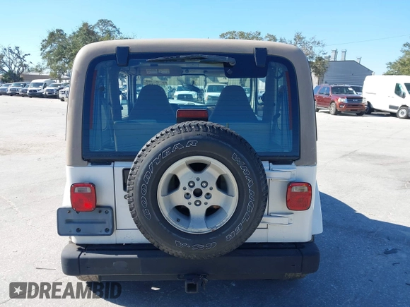 2001 Jeep Wrangler Sahara with VIN 1J4FA59S51P332107, listed as a IAAI auction lot 40954726 with 150,671 mi miles. Bid and sale history available at carsss.com. Image 16.