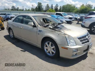2009 Cadillac STS AWD z VIN 1G6DD67V390151523, wystawiony jako Copart lot #58758675 z przebiegiem Nie podano mil oraz Szkoda całkowita • Salvage title. Historia ofert i sprzedaży dostępna na DreamBid. Obrazek 4.