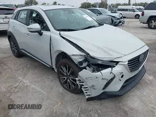 2016 Mazda CX-3 Grand Touring with VIN JM1DKDD72G0128891, listed as a IAAI auction lot 41401456 with 60,911 mi miles. Bid and sale history available at carsss.com. Image 6.