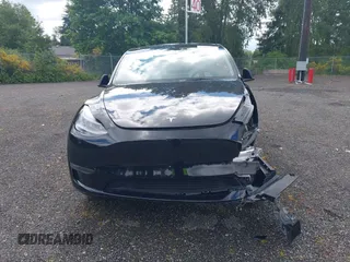 2023 Tesla Model Y Long Range z VIN 7SAYGDEE2PF885116, wystawiony jako IAAI lot #40091902 z przebiegiem 11 779 mil mil oraz . Historia ofert i sprzedaży dostępna na DreamBid. Obrazek 12.
