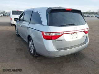 2012 Honda Odyssey Touring with VIN 5FNRL5H96CB095264, listed as a IAAI auction lot 41403450 with 246,199 mi miles. Bid and sale history available at carsss.com. Image 3.