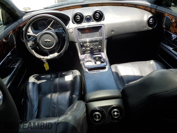 2011 Jaguar XJ with VIN SAJWA1CBXBLV12152, listed as a Copart auction lot 62010855 with 125,697 mi miles and Salvage title. Bid and sale history available at DreamBid. Image 8.